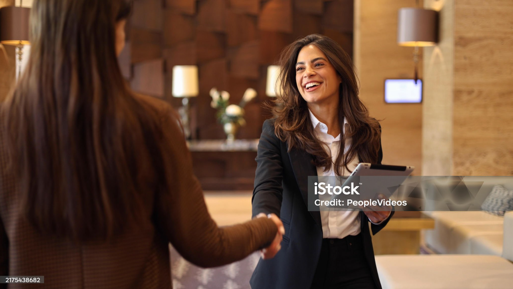 Hispanic professional real estate agent shaking hands